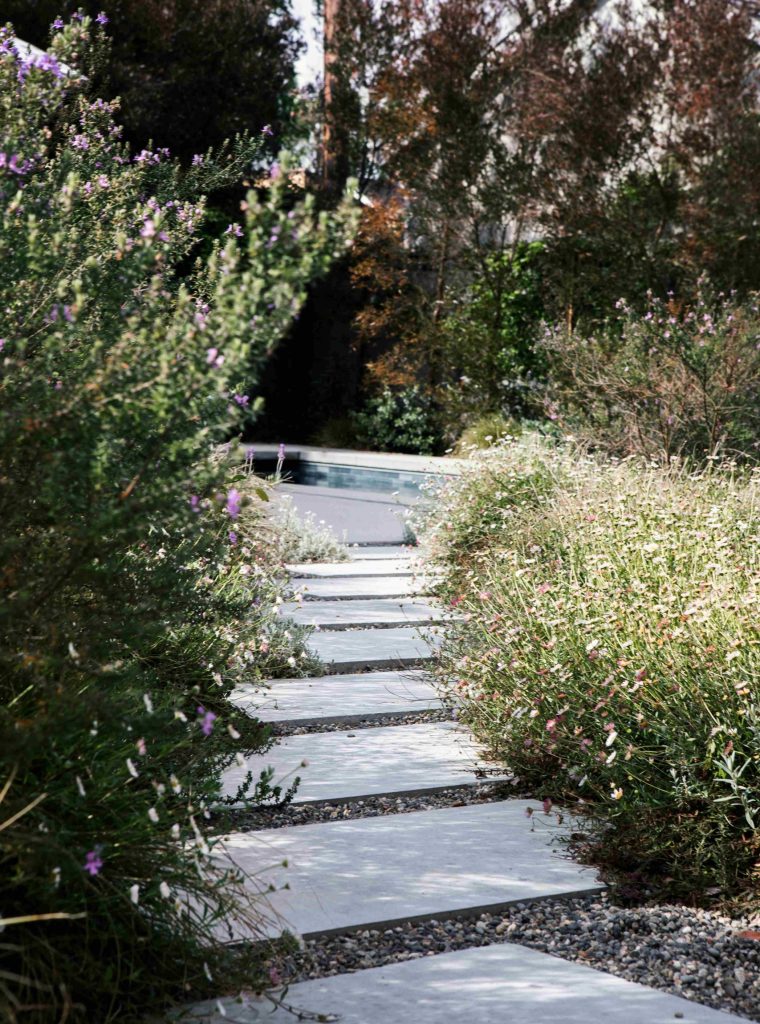 stone-path-leading-to-pool-in-a-garden-2026-01-07-23-24-14-utc_11zon