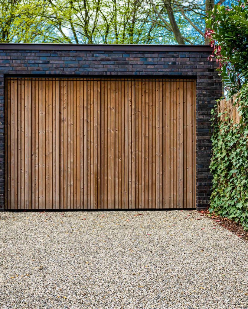 wide-garage-door-and-concrete-driveway-in-front-2026-03-16-22-44-58-utc_11zon